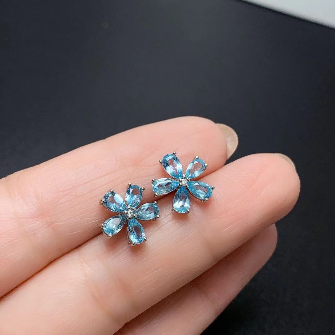 Pendientes de topacio azul natural con incrustaciones de plata 925 y flor de rosa