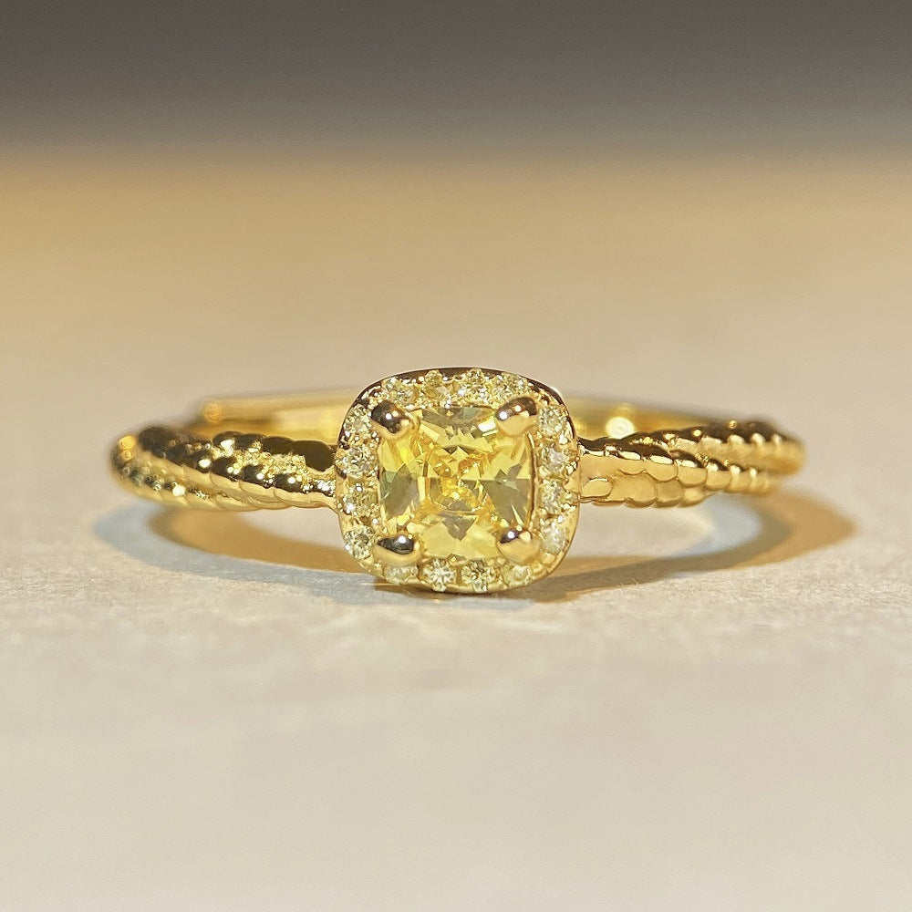 Sterling silver cube yellow diamond ring refers to a small fresh and simple ring.