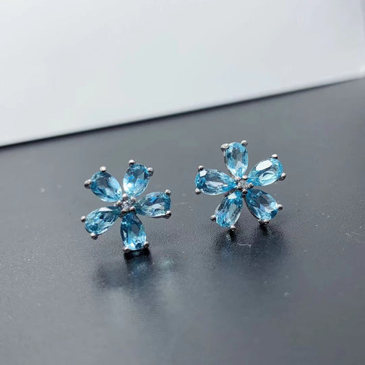 Pendientes de topacio azul natural con incrustaciones de plata 925 y flor de rosa