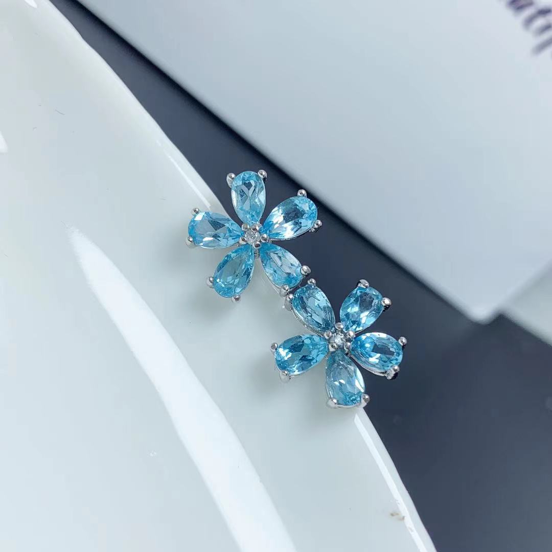 Pendientes de topacio azul natural con incrustaciones de plata 925 y flor de rosa